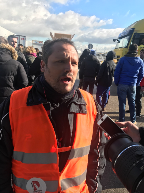 Eduardo Hernandez protests at a facility outside Madrid.
